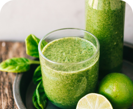 Fresh green smoothie with spinach and lime representing healthy nutrition and weight management